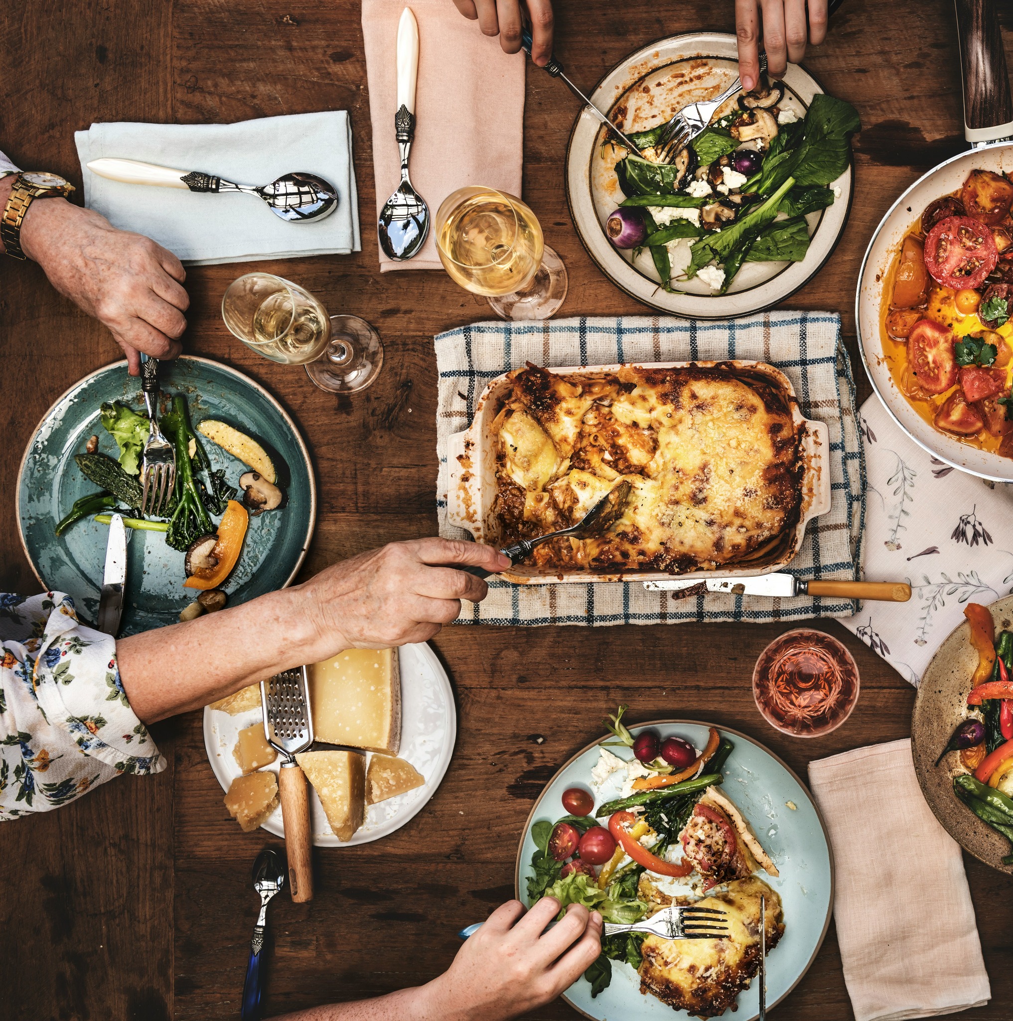 A table with lasagne and homemade dishes